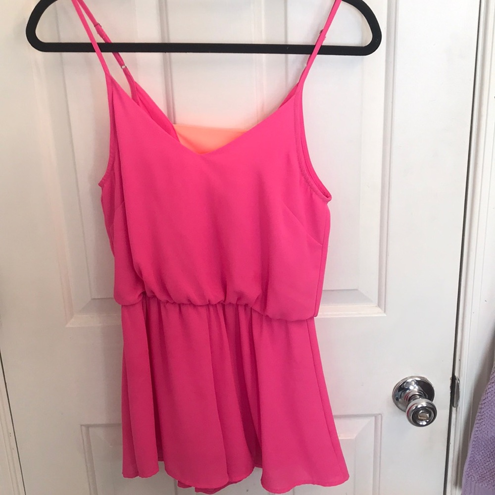 Bright pink romper with orange detail